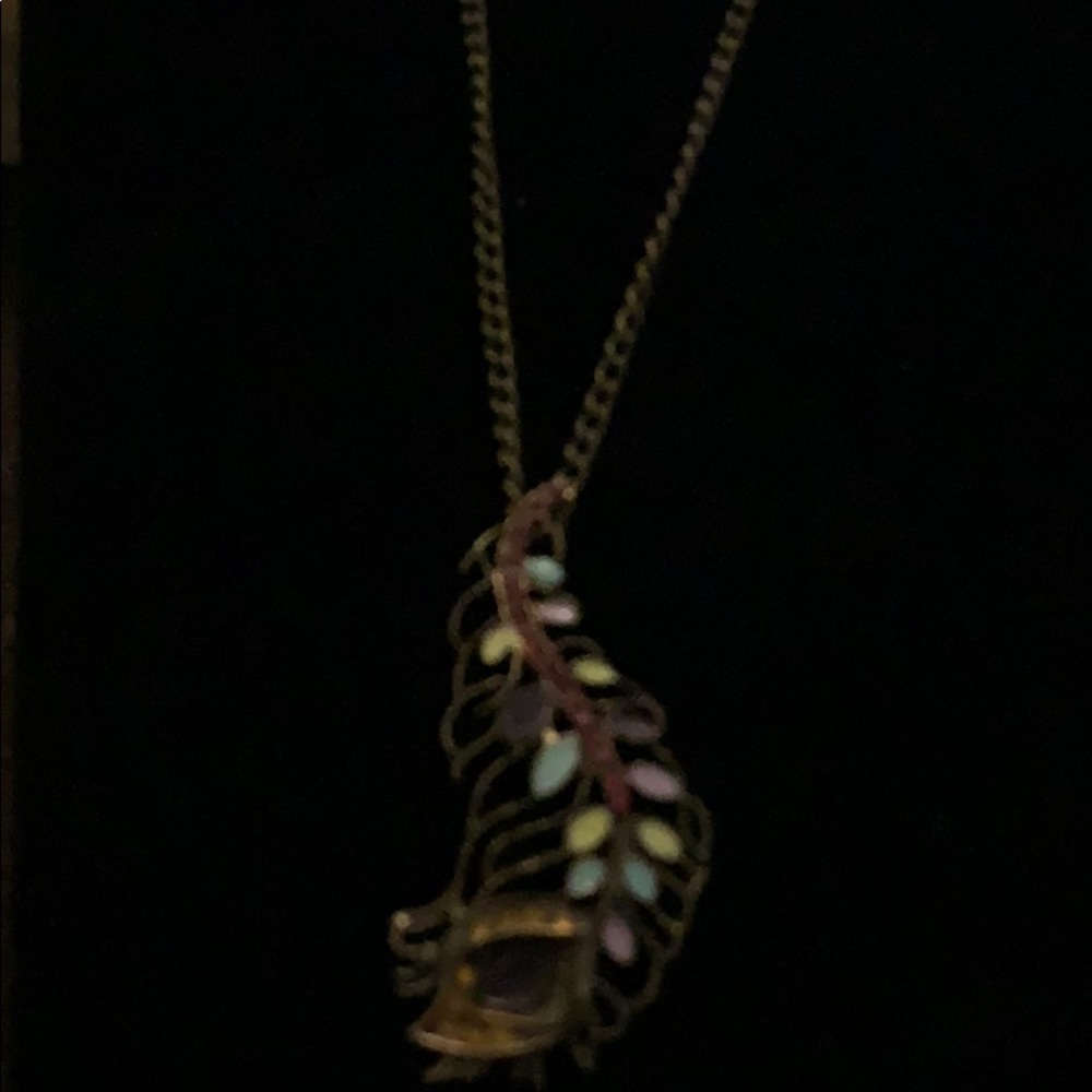 Peacock tail with multiple colored stone inlays
